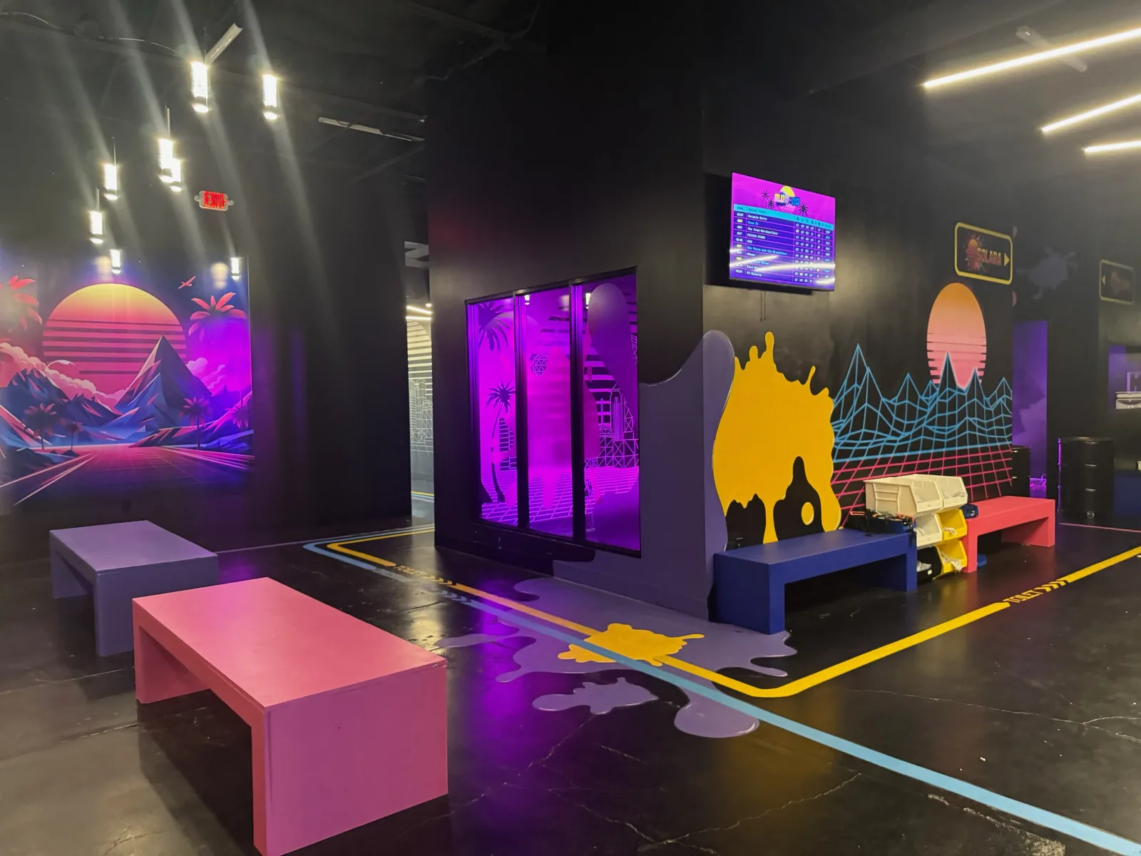Finished neon lit entertainment venue with lounge seating, commercial tenant finish out