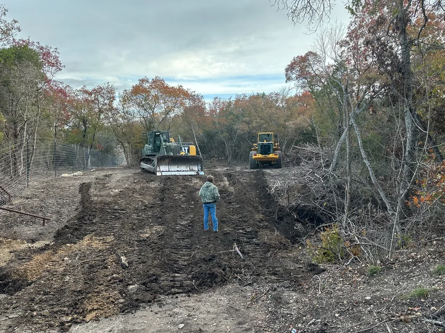 Dozer and wheel loader clearing a wooded site, data center site work