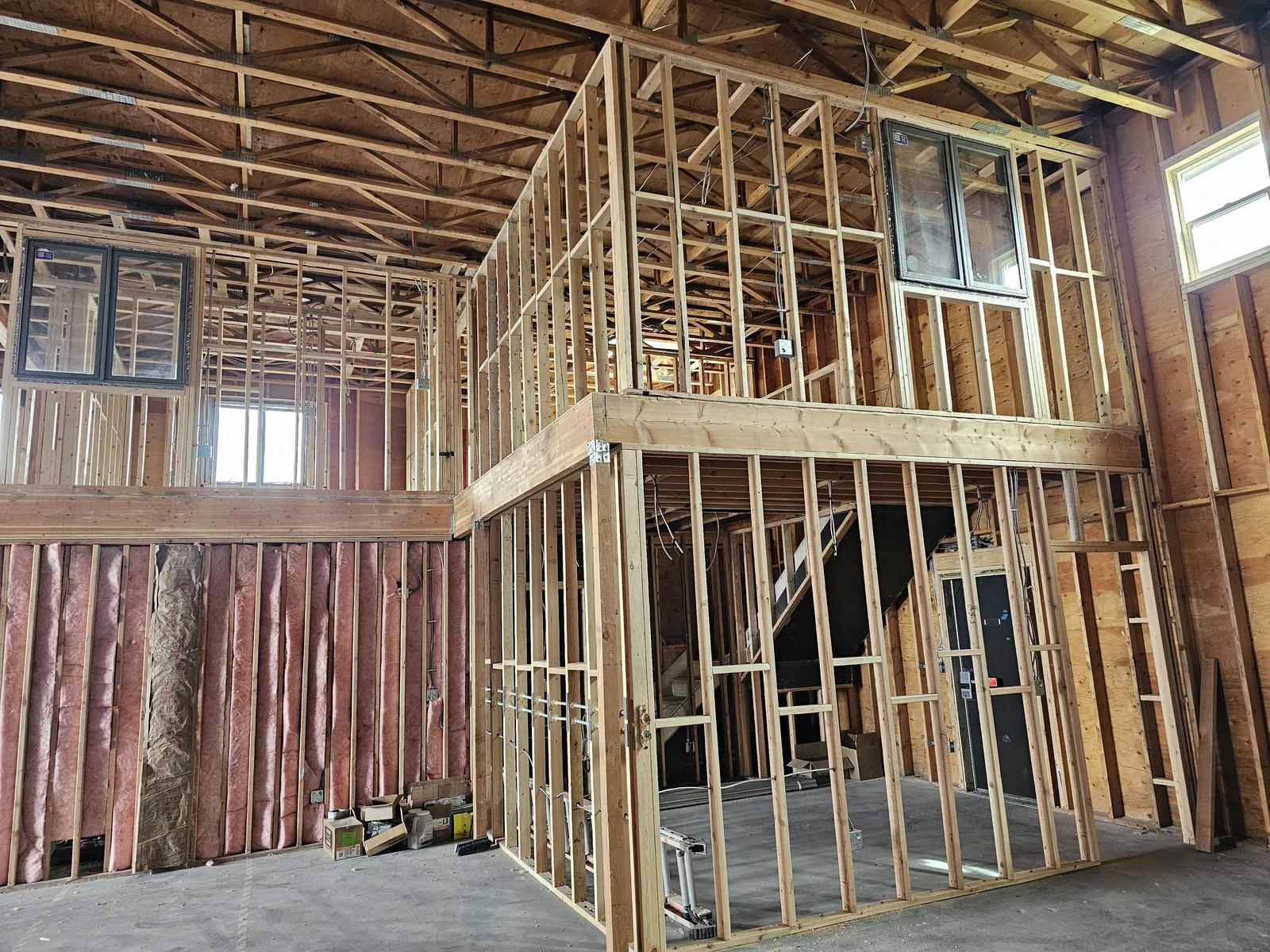 Framed loft rooms and insulated exterior walls inside the shell, commercial construction