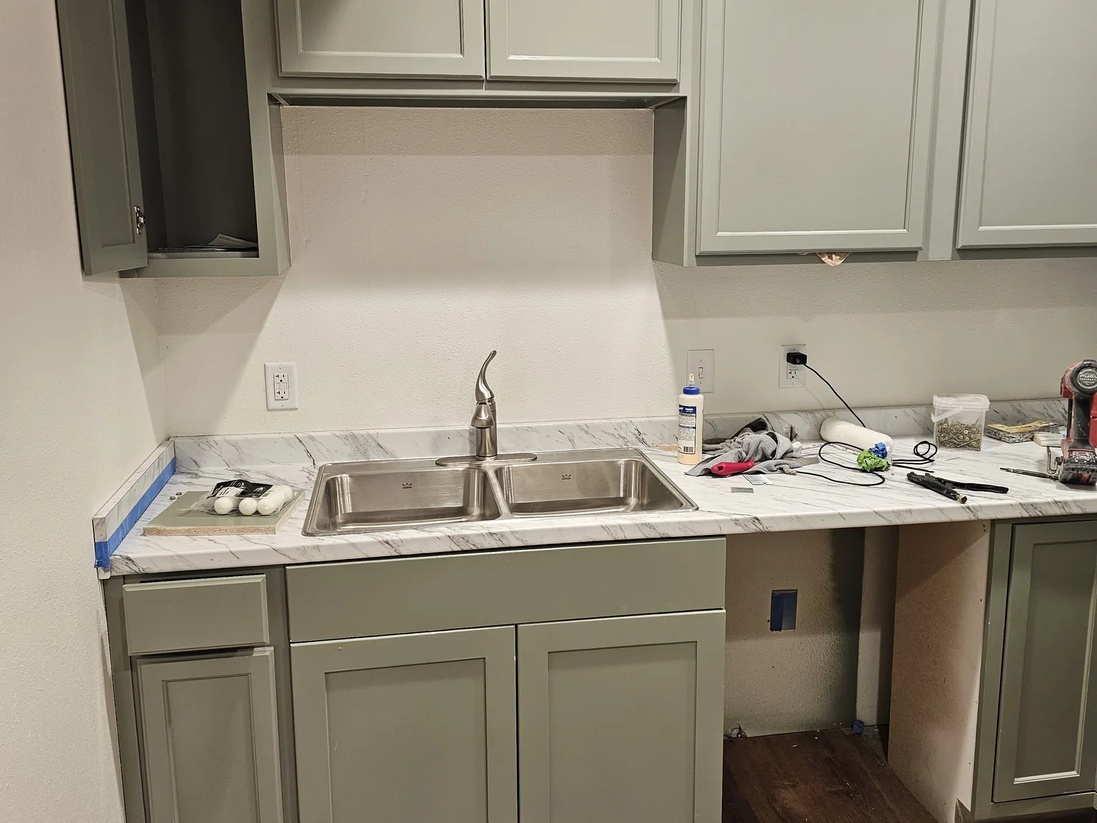 Kitchenette cabinets, counter and sink going in, commercial construction
